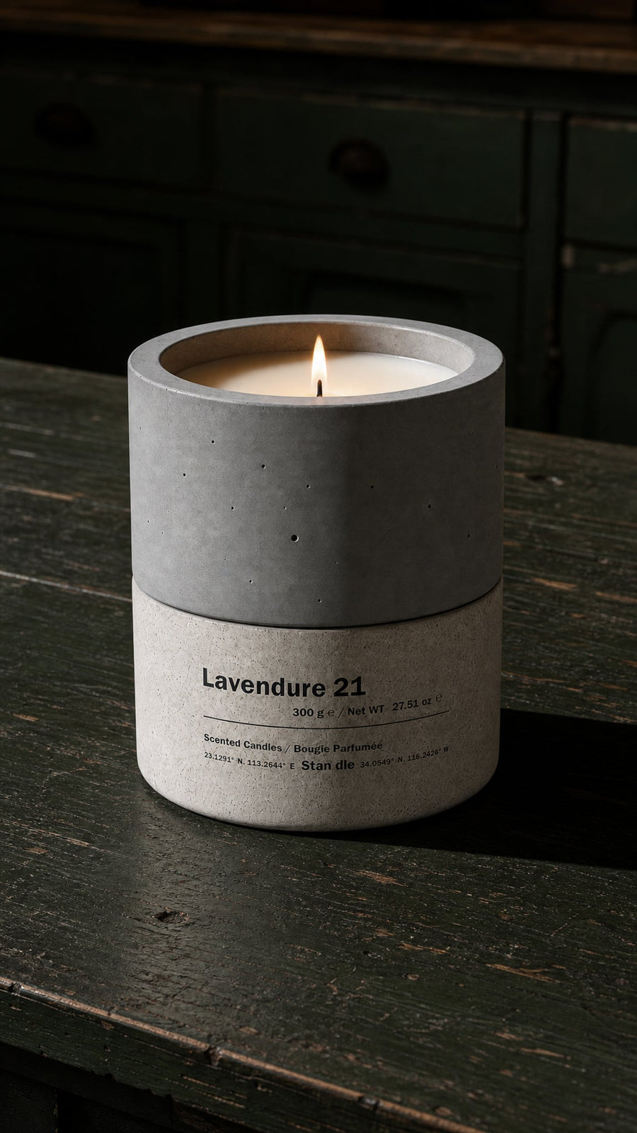 Lavendure 21 hand-cast concrete soy candle burning on dark wood surface — Stān dle Aromatic