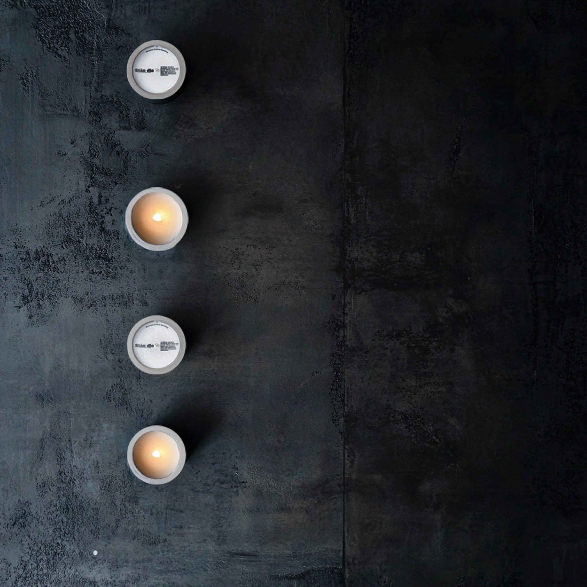 Candles displayed on a concrete surface — TSA rules for flying with candles