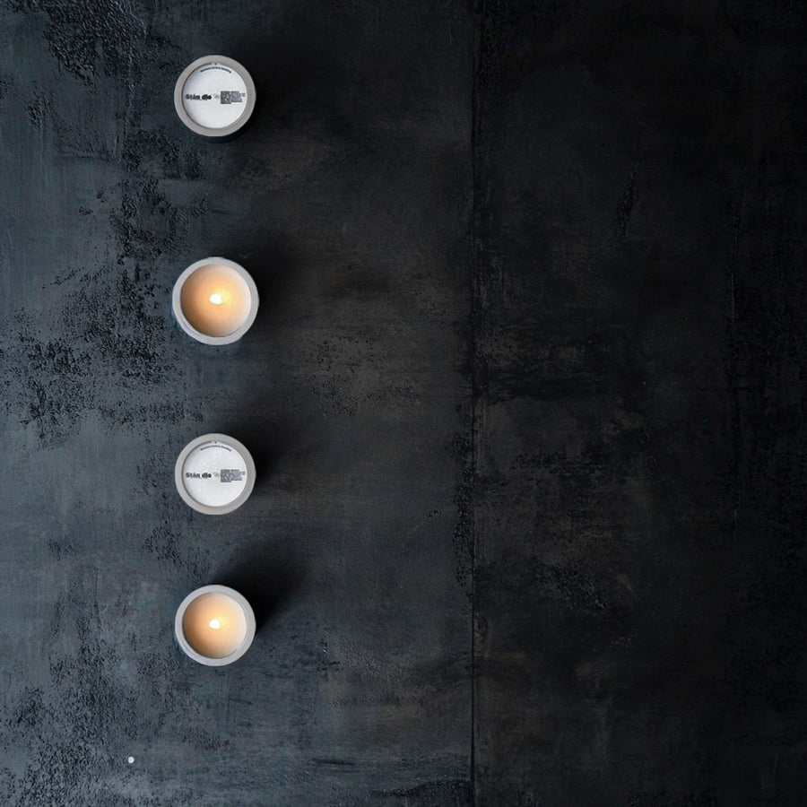 Candles displayed on a concrete surface — TSA rules for flying with candles