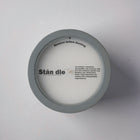 Top view of candle lid with brand logo and artisan-crafted message