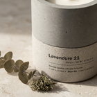 Close-up of Lavendure 21 hand-cast concrete vessel label with eucalyptus