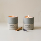 Sandalure 18 and Lavendure 21 concrete soy candles both burning with fragrance ingredients